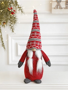 Détails de la texture tricotée et du nez en bois d'un gnome de Noël rouge et gris