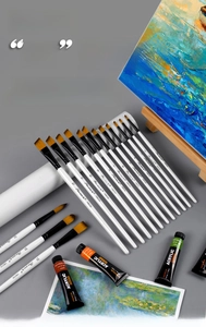 Detail of 12 white birch paintbrushes with nylon bristles and acrylic paint tubes