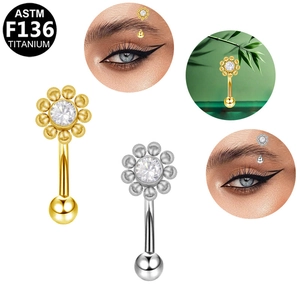 ASTM F136 titanium eyebrow ring with zircon flower top shown on model and still life