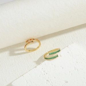 Double-layered geometric rings with colorful and green baguette cubic zirconia on stones