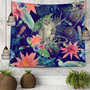 Exotic tapestry with monkey and peacock motifs on a blue background in home setting