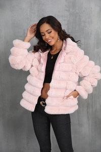 Detail of pink faux fur coat showing plush texture and horizontal striped pattern