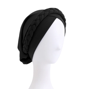 Black elastic turban hat with braided design for women shown on head mannequin