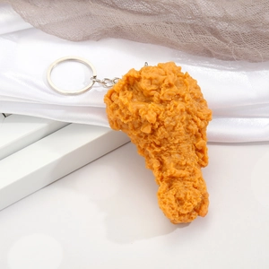 Realistic fried chicken leg keychain with golden crispy texture and silver metal ring