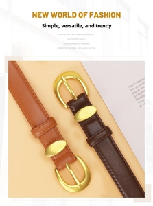 Detail of tan and dark brown women's leather belts with golden horseshoe buckles