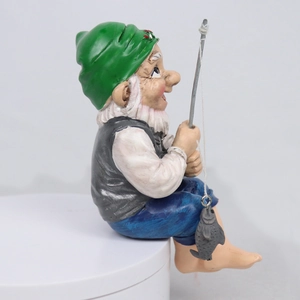 Resin garden gnome ornament featuring an old man fishing in colorful attire and detailed texture