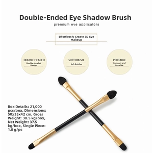 Detailed close-up of a double-ended eyeshadow brush with sponge tip and soft black bristles