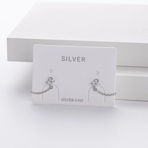 Close-up of S925 sterling silver flower earrings with zircon pave and chain tassels