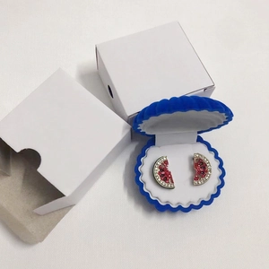 Watermelon stud earrings with red and green rhinestones in blue shell jewelry box
