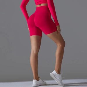 Close-up of seamless rose red yoga shorts featuring high waist and peach butt lift texture