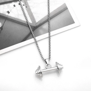 Detailed view of silver fitness dumbbell pendant necklace on a clean white background