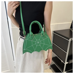 Detail showing green spider web stitching and PU leather texture on the creative novelty bag