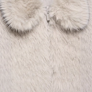 Short faux fur jacket for women in light grey with metallic zipper and stand collar