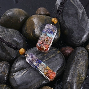 Macro view of Orgone Chakra pendant with natural crushed stones and copper spiral wire