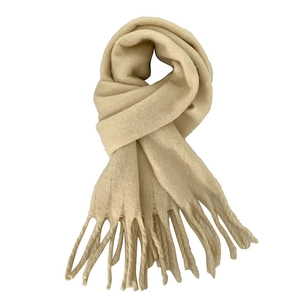 Thick beige mohair winter scarf for women featuring soft knitted texture and elegant tassels