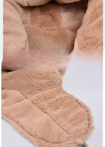 Close-up of caramel faux fur texture on windproof winter trapper hat with soft plush lining