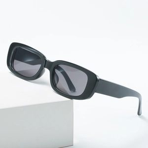Retro small square sunglasses for women with thick black frames and dark lenses