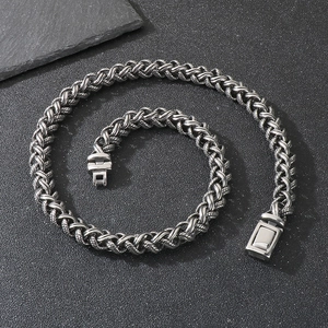 Men's titanium steel dragon bone chain necklace with antique silver finish and toggle clasp