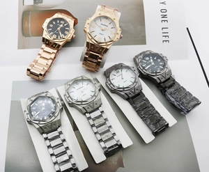 Detail view of quartz watches with multi-dial faces and stainless steel bands in diverse colors