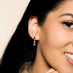 Chic 18k gold plated stainless steel teardrop earrings with crystals on female model