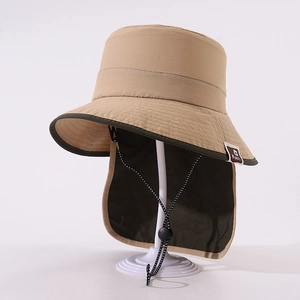 Detail of khaki sun hat featuring a wide brim and protective neck flap with wind cord