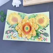 Detailed top view of 3D pop-up card featuring handmade sunflowers and honeybees