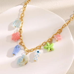 18K gold plated necklace with colorful ceramic ocean charms like sea turtles and fish