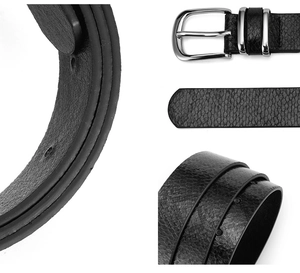 Détails macro d'une ceinture en cuir de serpent noir avec boucle argentée polie