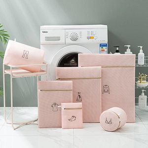 Detailed macro shot of 6-piece pink mesh laundry bags set with garment icons for washing machine