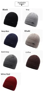 Close-up showing seven color options for ribbed knit beanies with leather logo patch