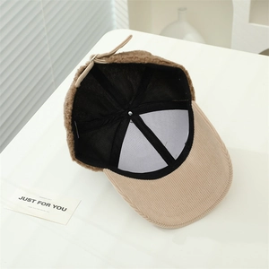 Detail view of lambswool baseball cap interior showing lining and adjustable buckle strap