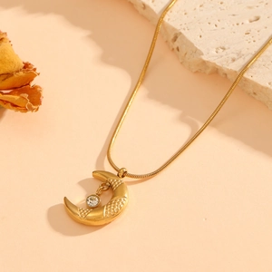 Gold stainless steel snake chain necklace with crescent moon pendant and zircon accent
