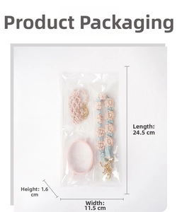 Detail of pink daisy crochet water bottle carrier set in transparent packaging with dimensions