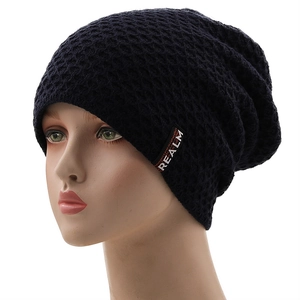 Winter thermal knit beanie hat with fleece lining and Realm logo label for outdoor skiing