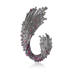 Vintage gunmetal wave brooch with pink and purple rhinestones on a white background