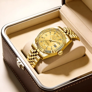 Detail of luxury gold men's steel watch with Roman numerals inside a brown leather box