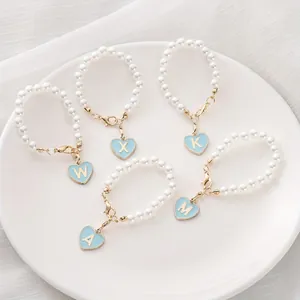 Pearl charm chain for Stanley cup featuring gold heart pendants with custom letters