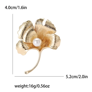 Elegant gold ginkgo leaf brooch with pearl detail and dimensions on white background