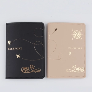 Close-up of Mr and Mrs PU leather passport covers with elegant gold foil stamping