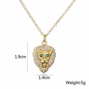 Macro shot of gold-plated lion head pendant necklace with zircon and size specs