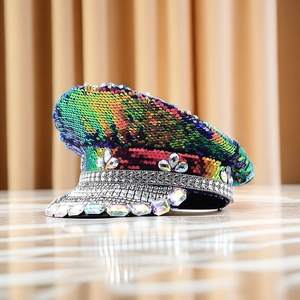 Detailed view of iridescent sequins and sparkling rhinestones on a captain party hat