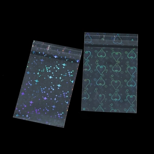 Macro detail of laser holographic self-sealing bags with star and heart patterns