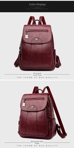 Detail view of burgundy sheepskin texture backpack with metal kangaroo logo and front pocket