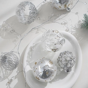 Silver and white Christmas ball ornament set featuring glitter and snowflake patterns