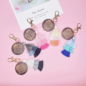 Detailed set of five wood MAMA keychains featuring three-layer gradient cotton tassels