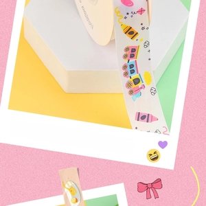 Detail view of colorful cartoon train pattern ribbon for gift wrapping and DIY crafts