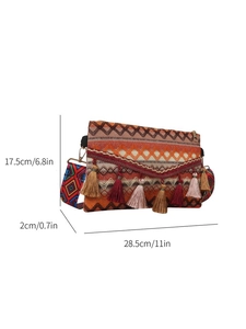 Detail of bohemian woven crossbody bag showing geometric patterns and colorful fringe