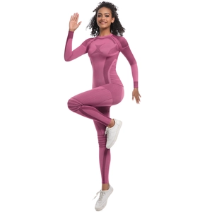 Detailed texture of seamless knit deep pink sports jumpsuit for yoga and fitness