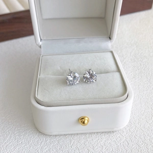 Close-up of sparkling S925 silver stud earrings with clear round cubic zirconia