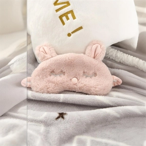 Cute pink plush rabbit sleep mask with soft faux fur and embroidered closed eyelashes